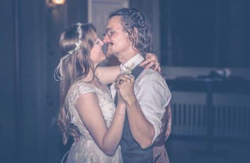 A bride and groom dancing and gazing into each others eyes